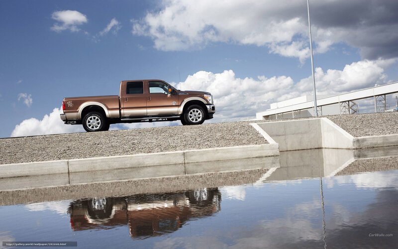 Brown pickup truck on gravel