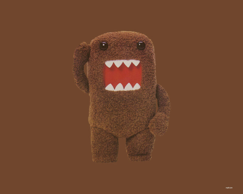 brown plush character with big mouth
