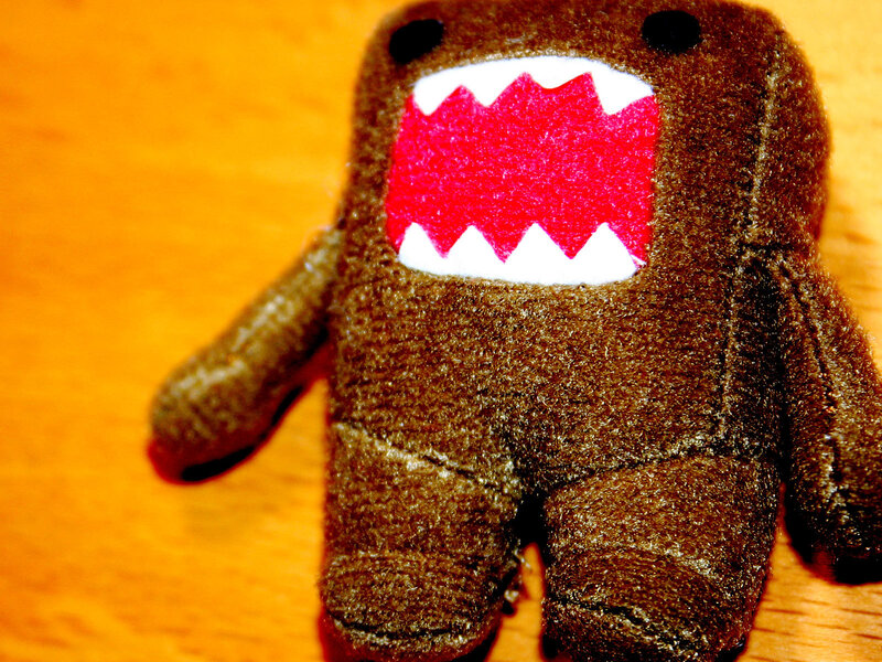 brown plush toy with red mouth