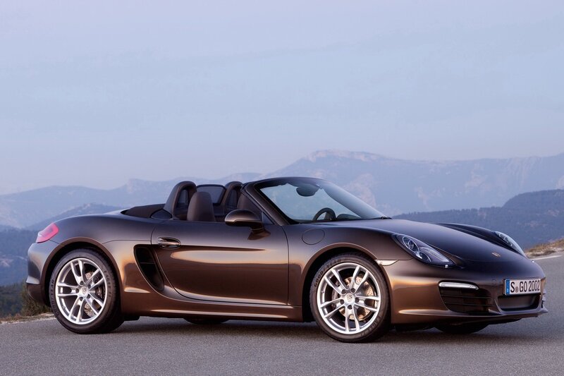 Brown Porsche Boxster on mountain road