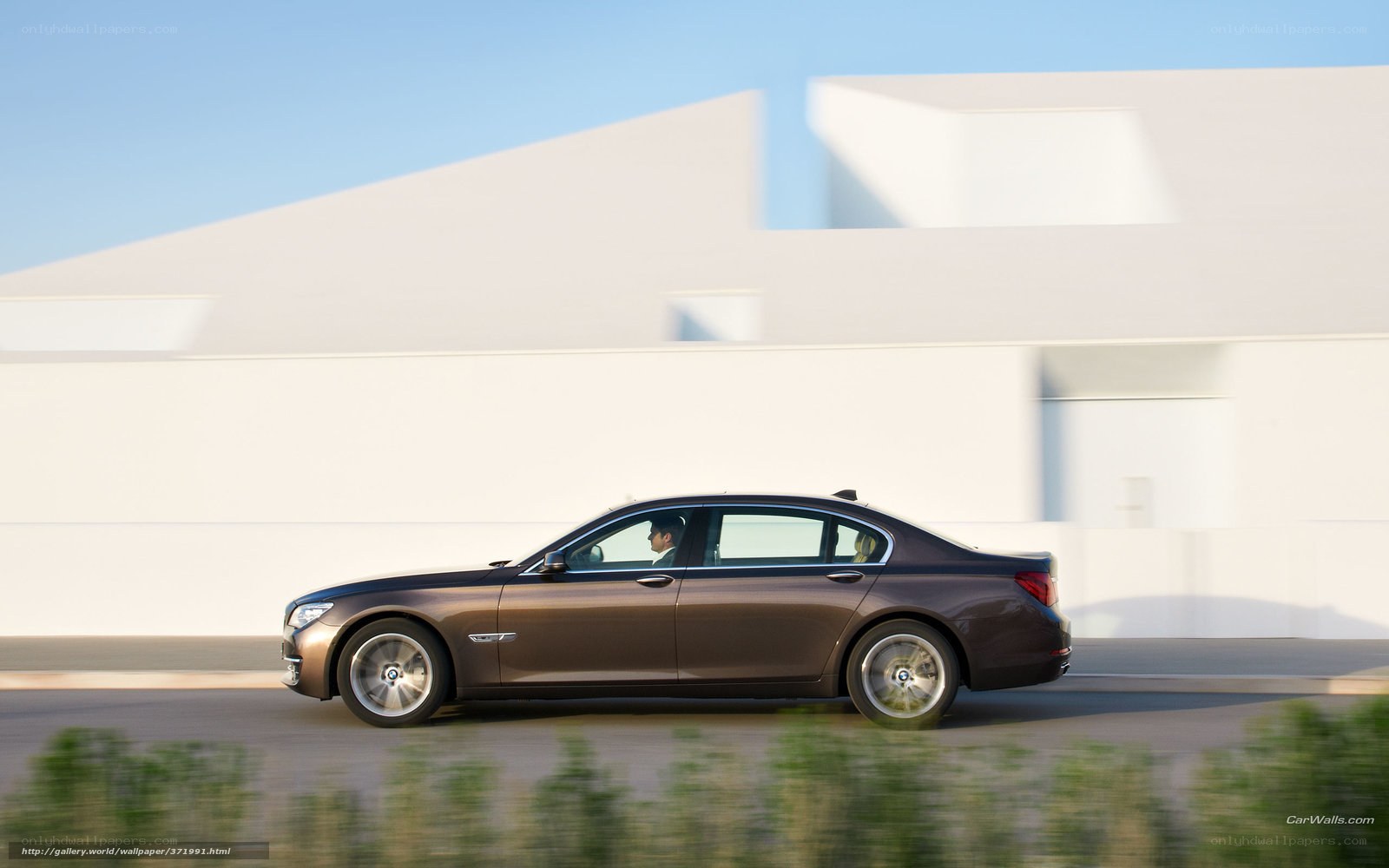 brown sedan in motion