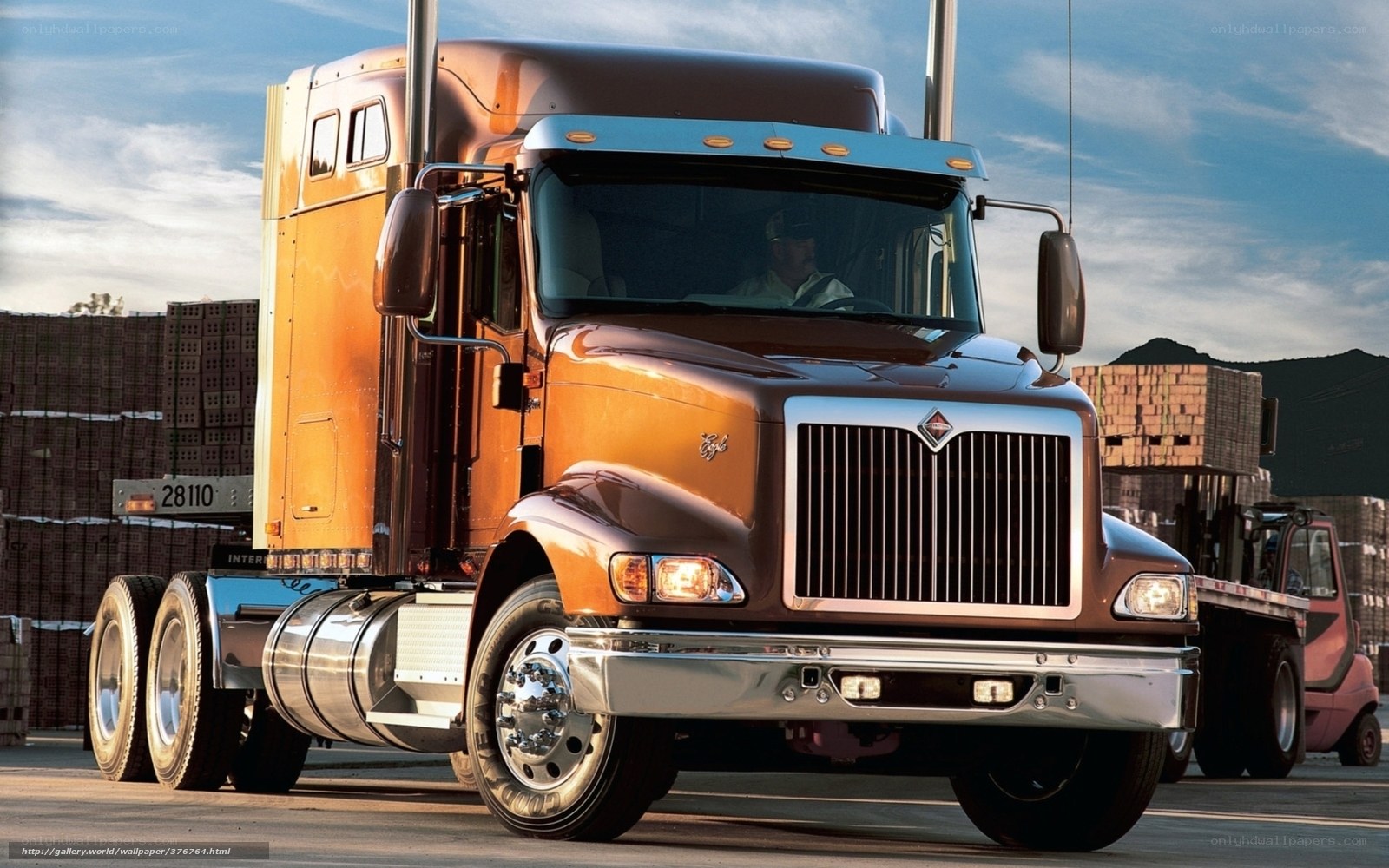 Brown semi-truck in a yard