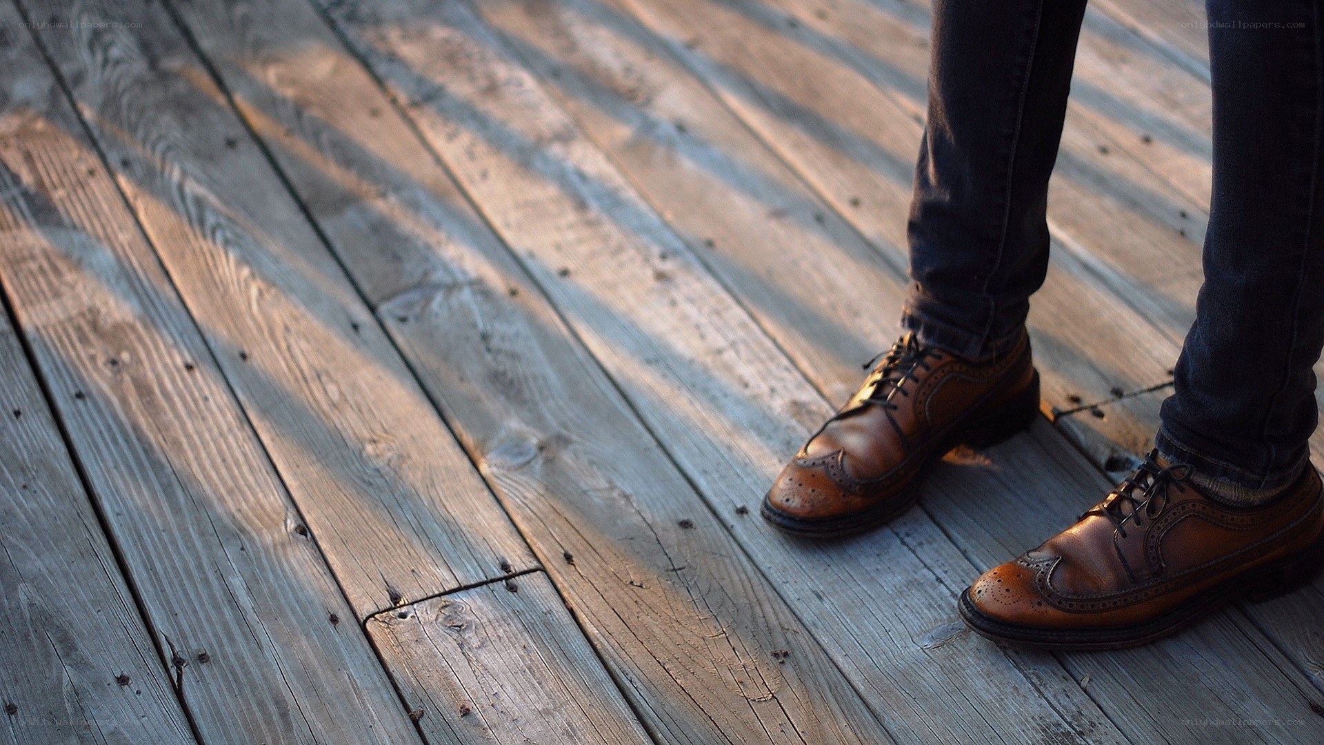 brown shoes on wooden deck