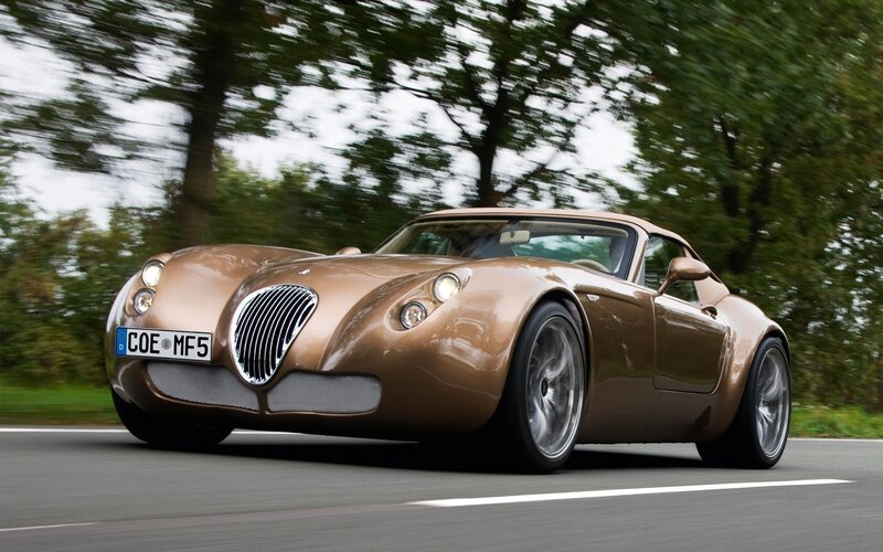 Brown sports car on road