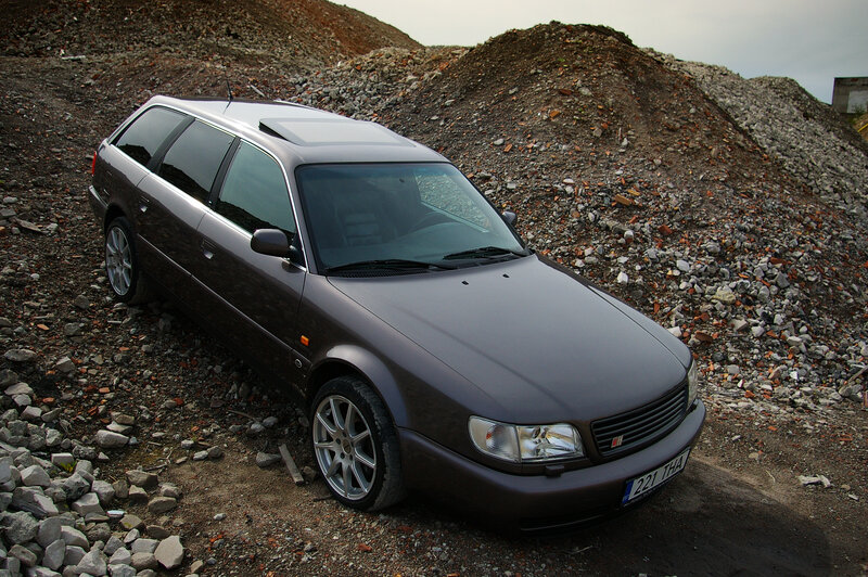 Brown station wagon on gravel
