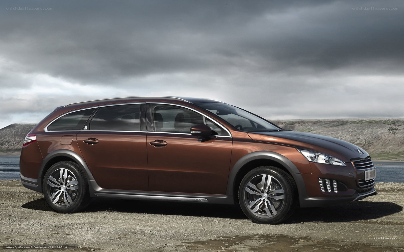 Brown station wagon on gravel