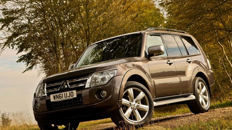 Brown SUV in a forest