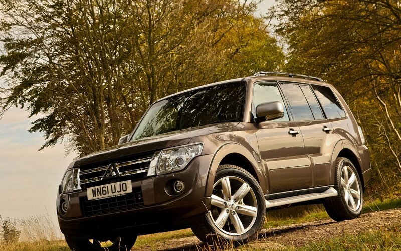 Brown SUV in autumn forest