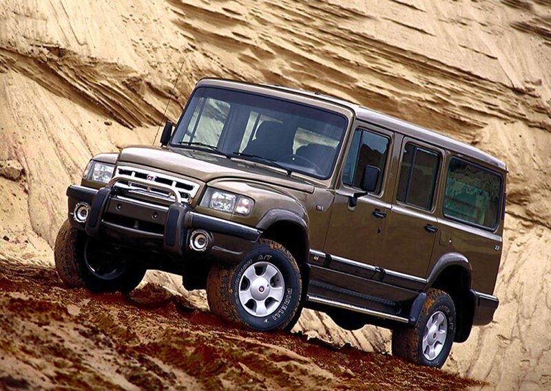 brown SUV on sand dune