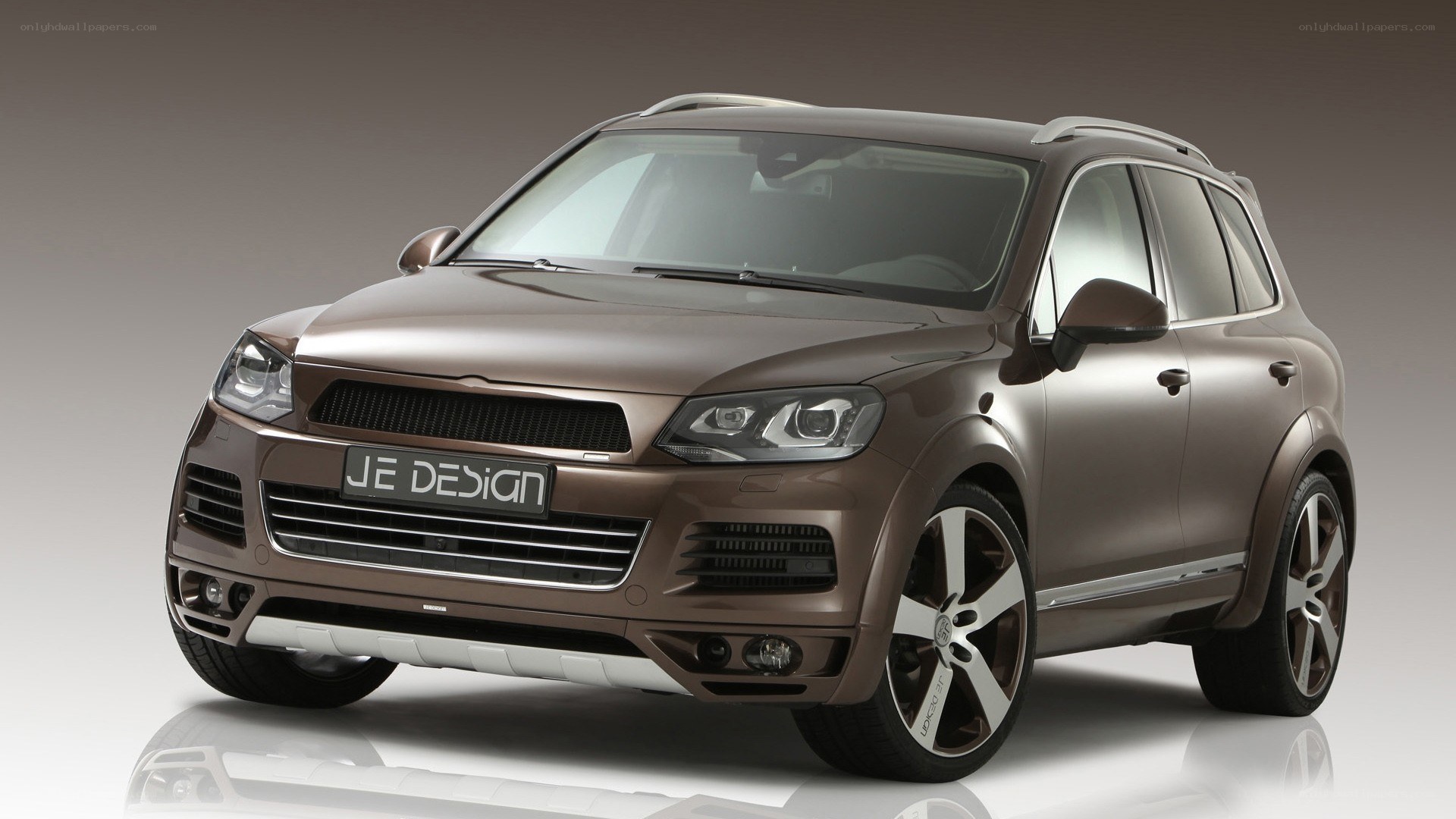 brown SUV with JE Design badge