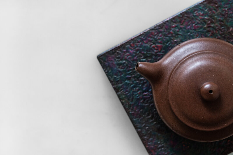 Brown Teapot on Mat