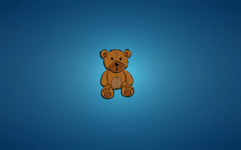 brown teddy bear on blue