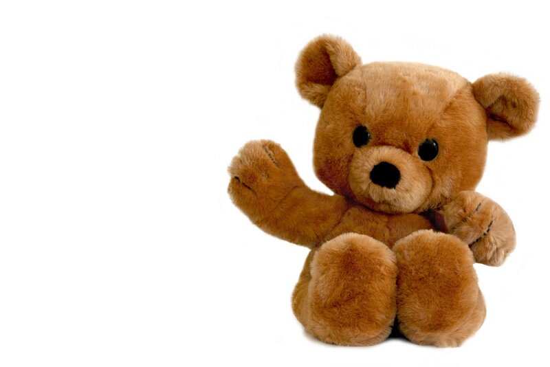 brown teddy bear waving