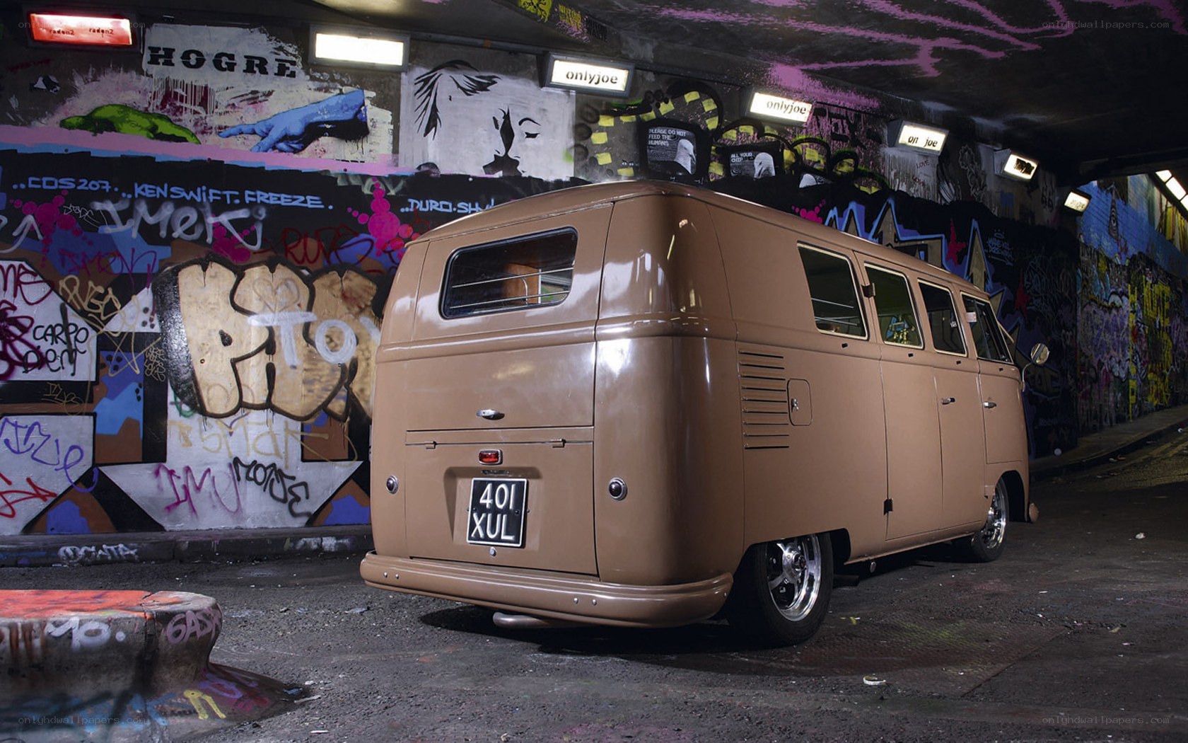 Brown van in graffiti tunnel
