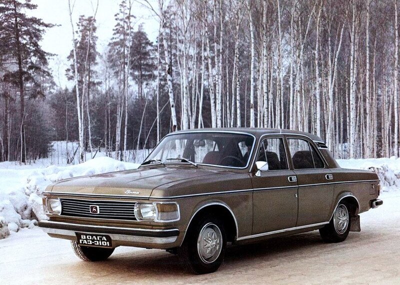 Brown Volga car in snowy forest