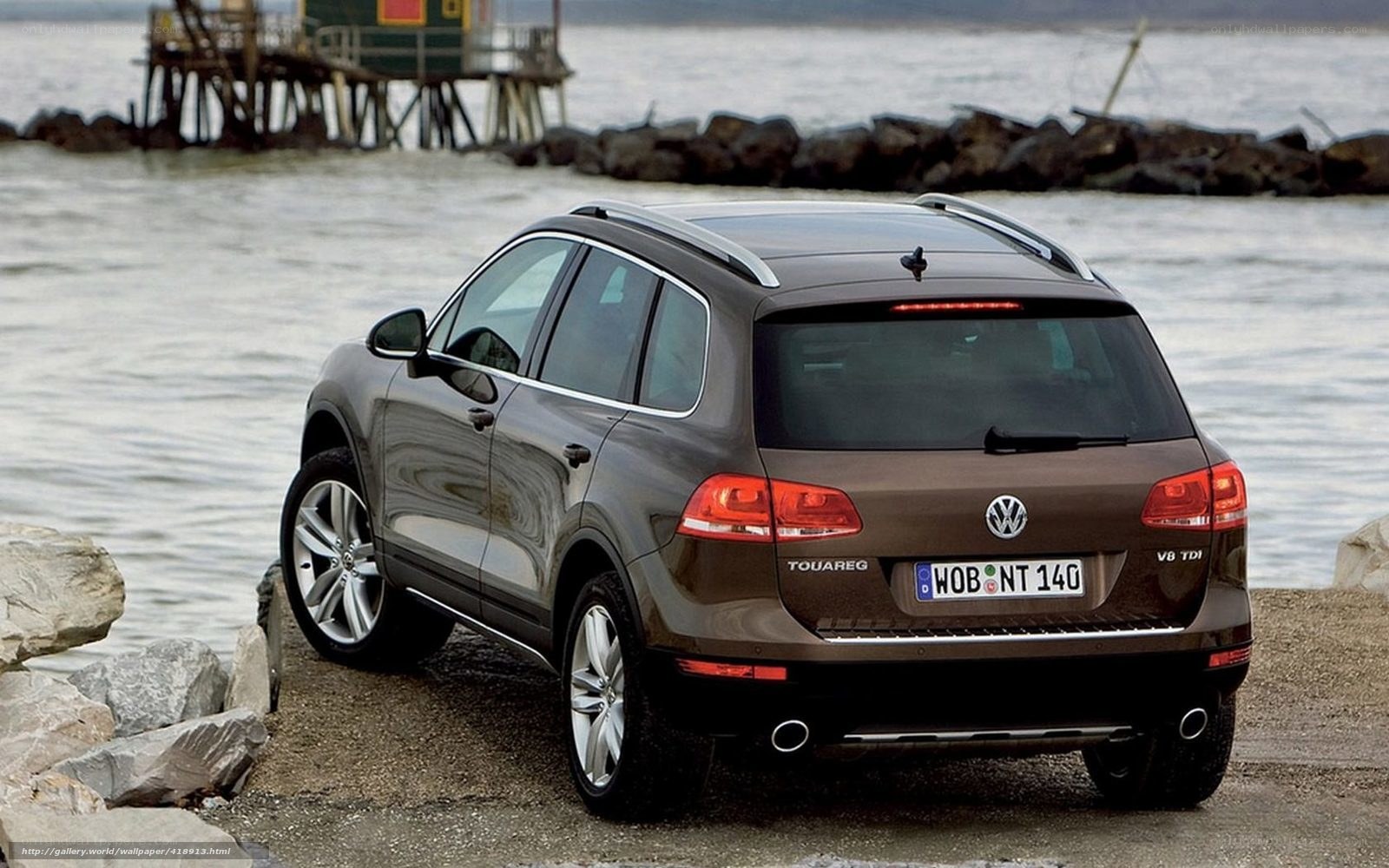 Brown Volkswagen Touareg by the water
