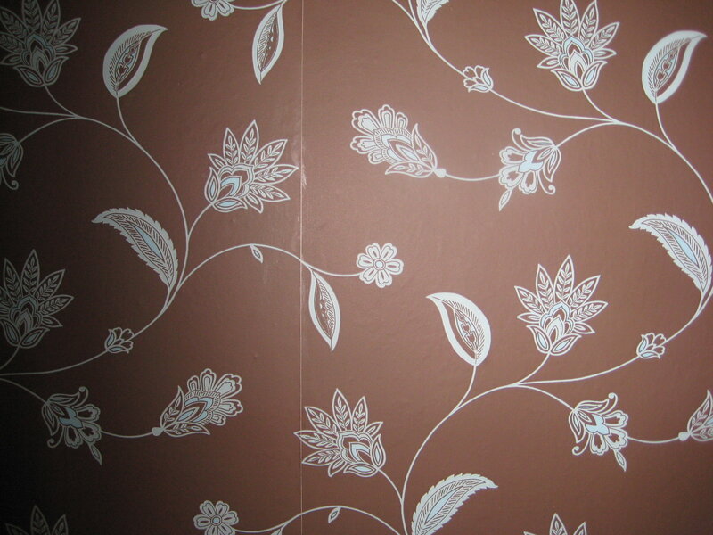 brown wallpaper with floral pattern