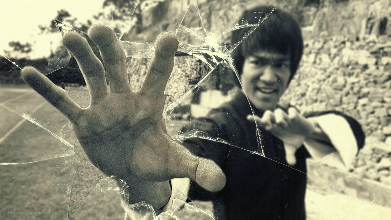 Bruce Lee breaking glass with hand