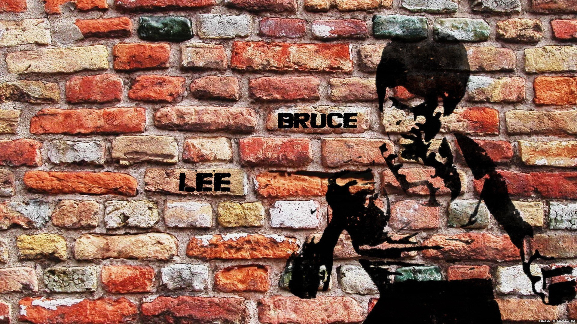 Bruce Lee graffiti on brick wall