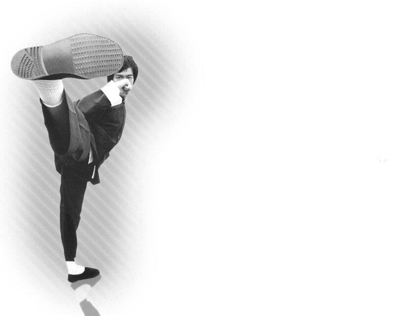 Bruce Lee performing a high kick