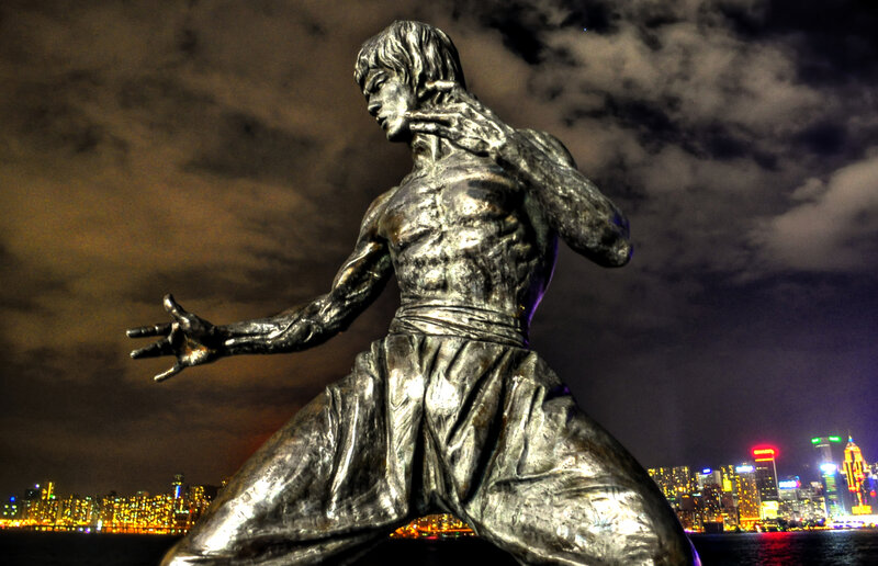 Bruce Lee statue at night