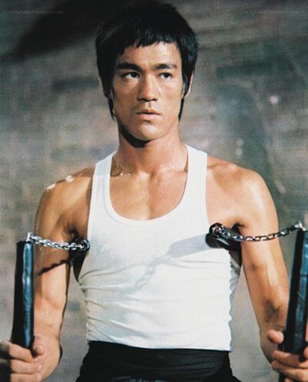 Bruce Lee with nunchucks