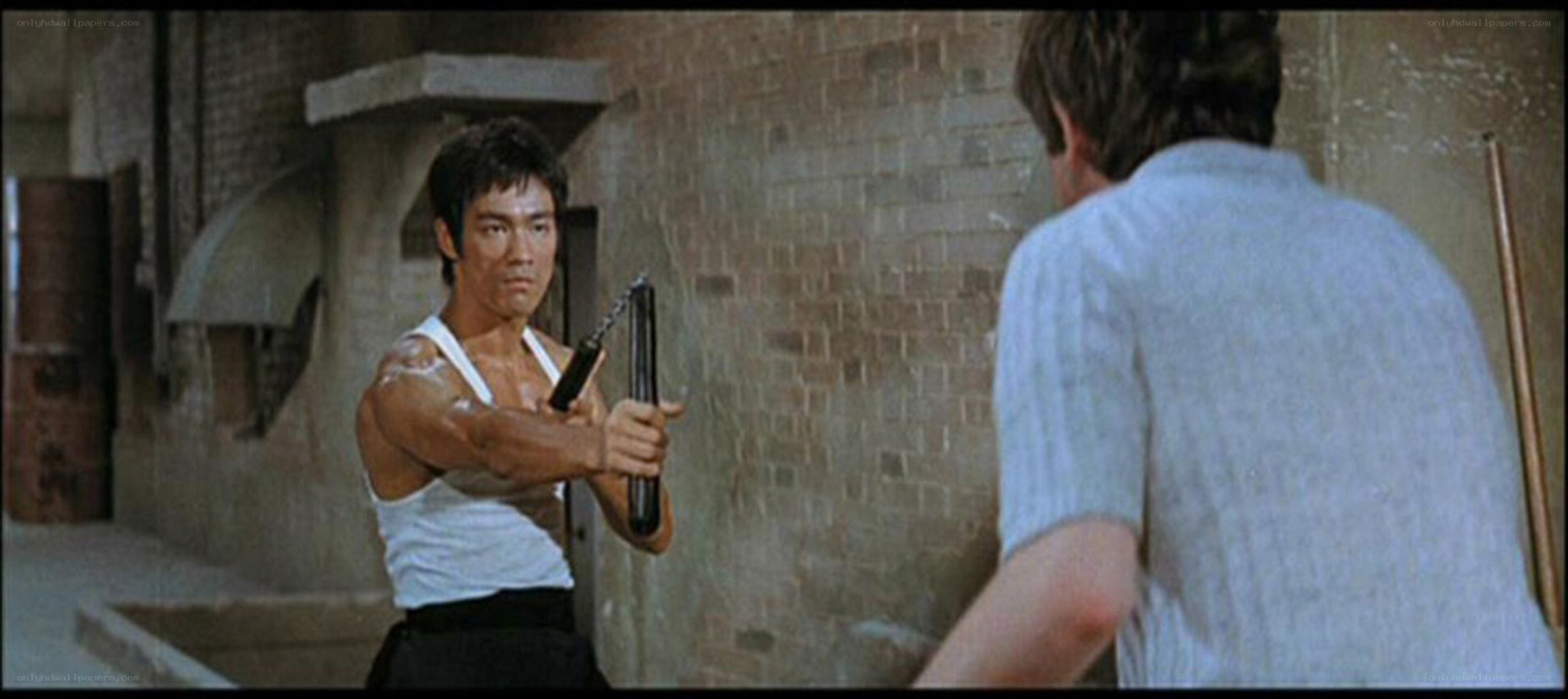 Bruce Lee with nunchucks
