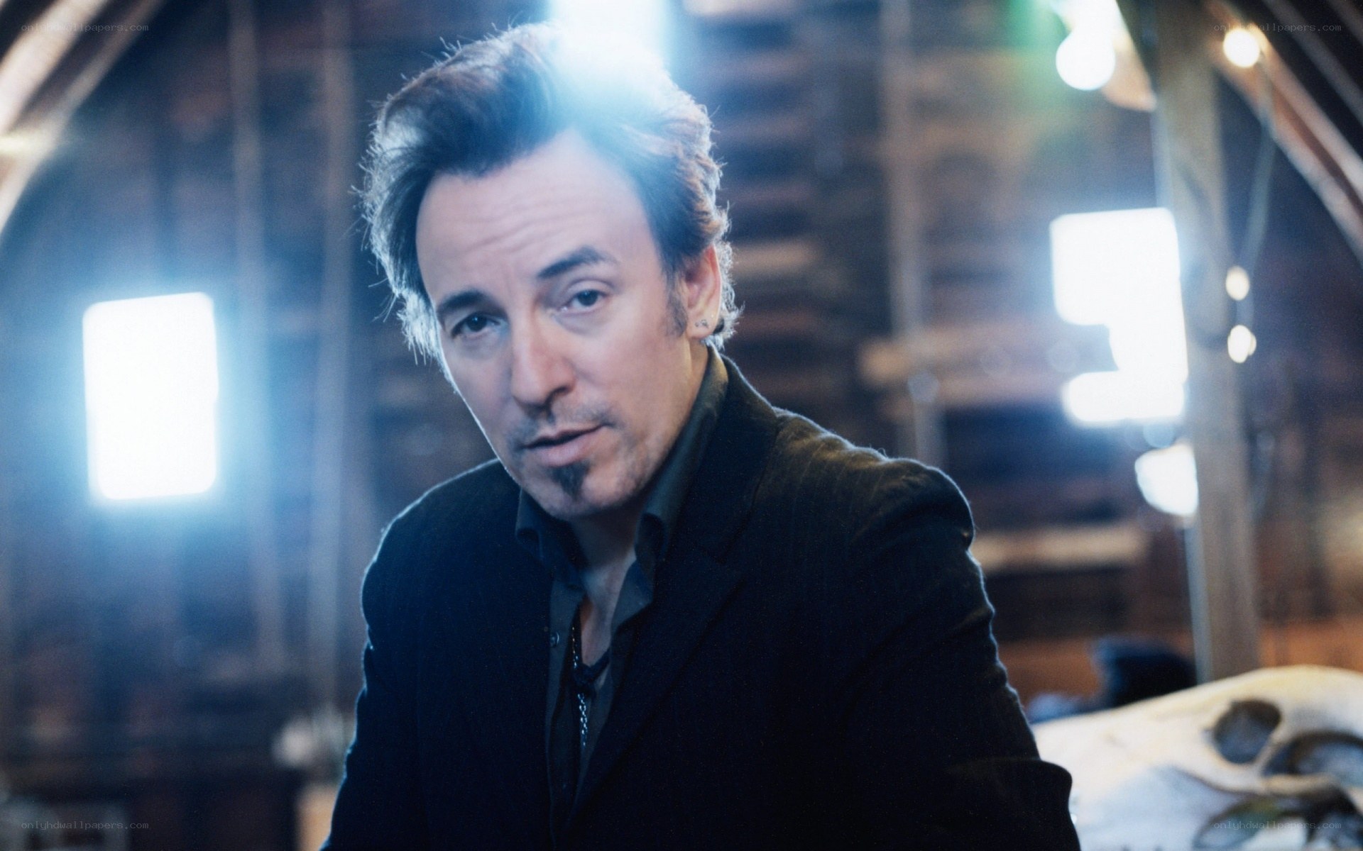 Bruce Springsteen in a dimly lit room