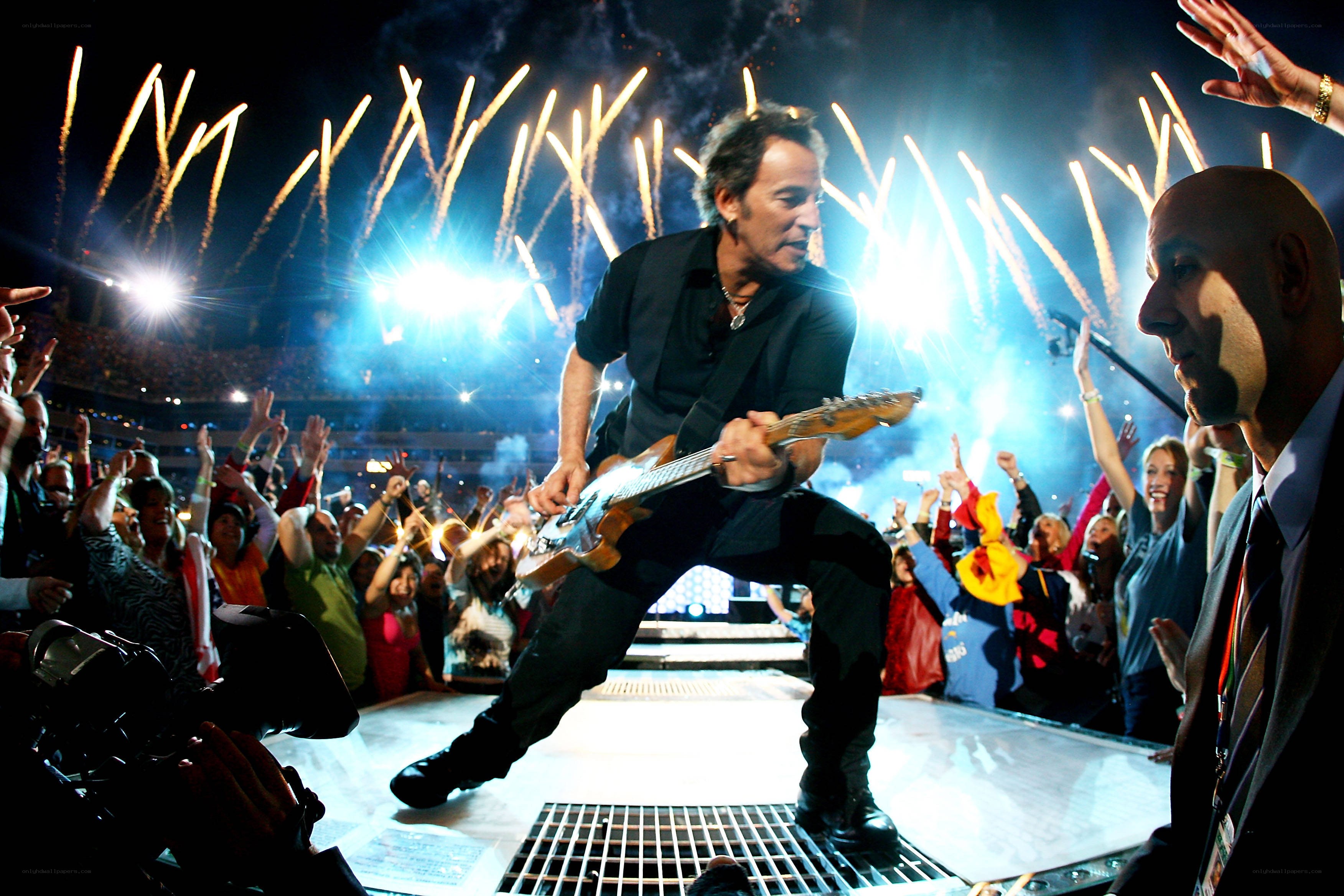 Bruce Springsteen on stage with fireworks