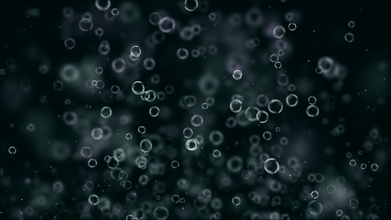 bubbles floating in dark water