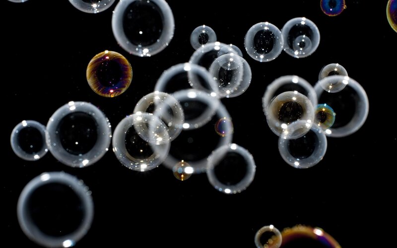 Bubbles floating in darkness
