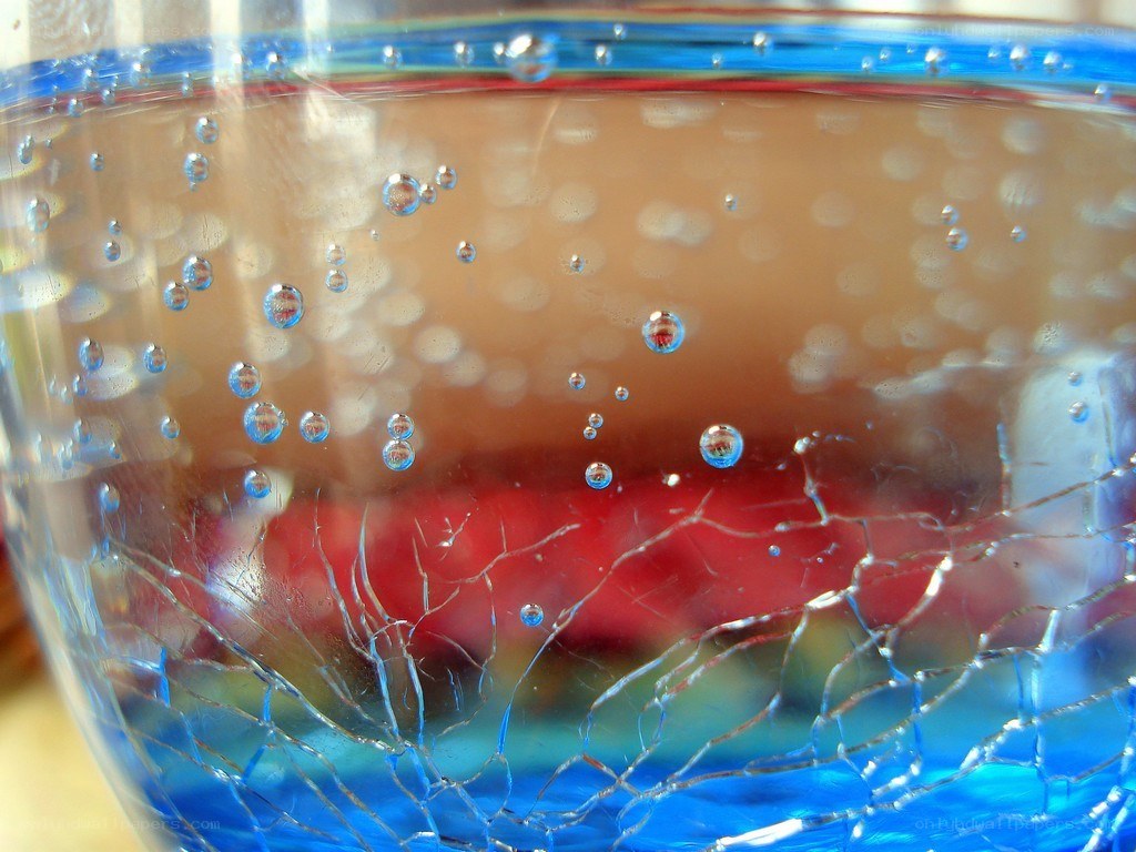 Bubbles in a blue glass