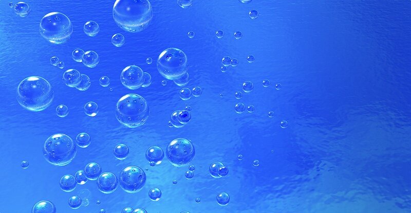 bubbles rising in blue liquid