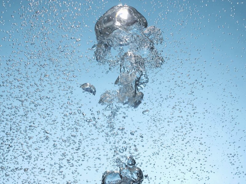 Bubbles rising in clear water