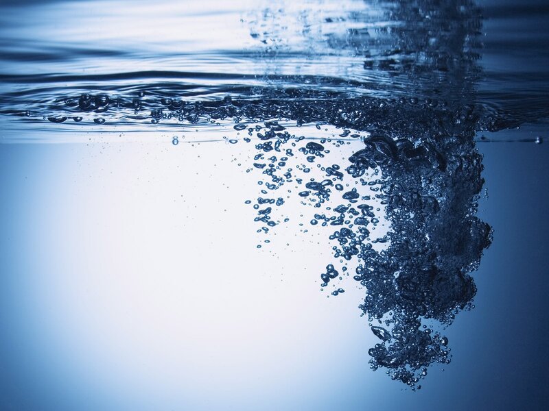 Bubbles Rising in Water — Photograph