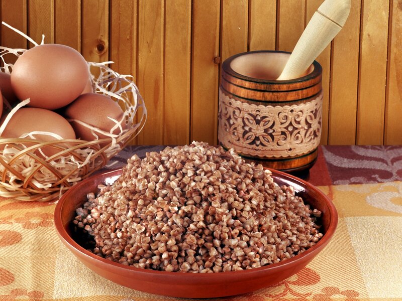 Buckwheat and eggs on table
