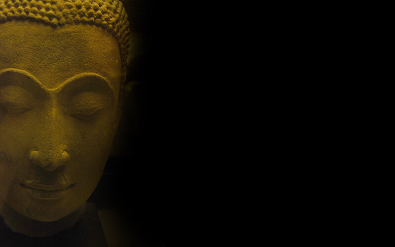 Buddha statue in dim light