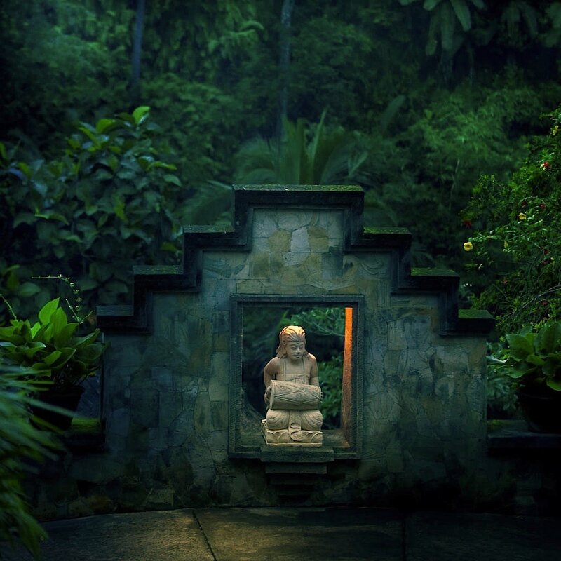 Buddha statue in garden niche