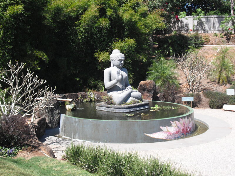 Buddha statue in garden pond
