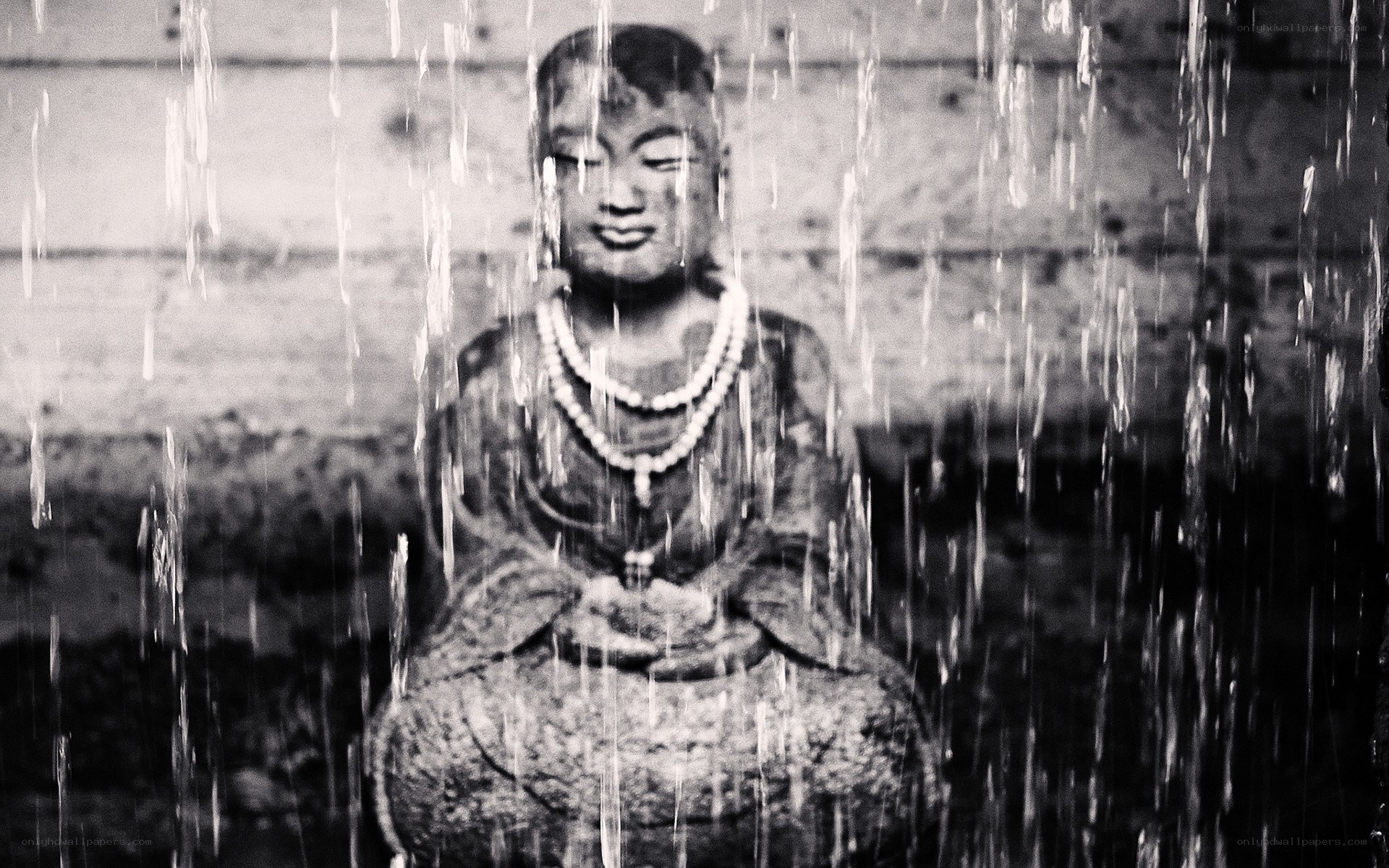 Buddha statue in rain