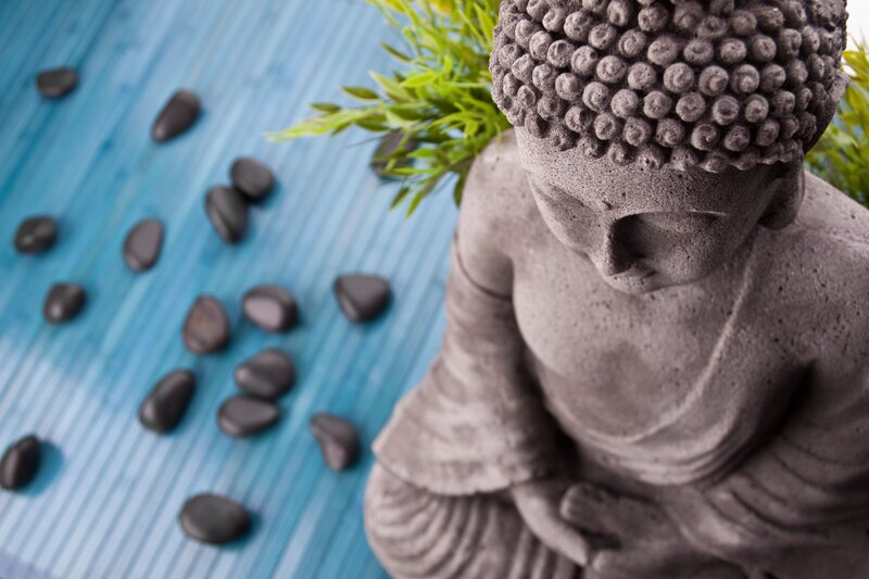 Buddha Statue on Blue Mat
