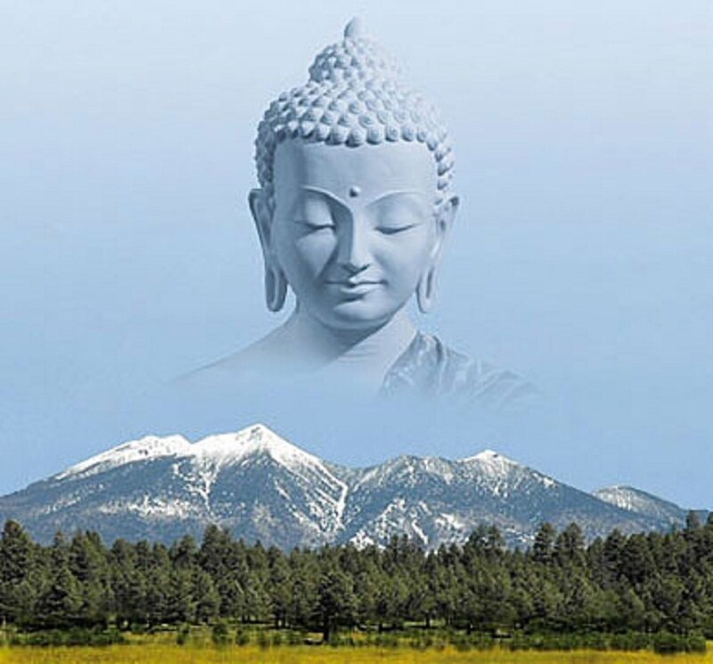 Buddha statue over mountains