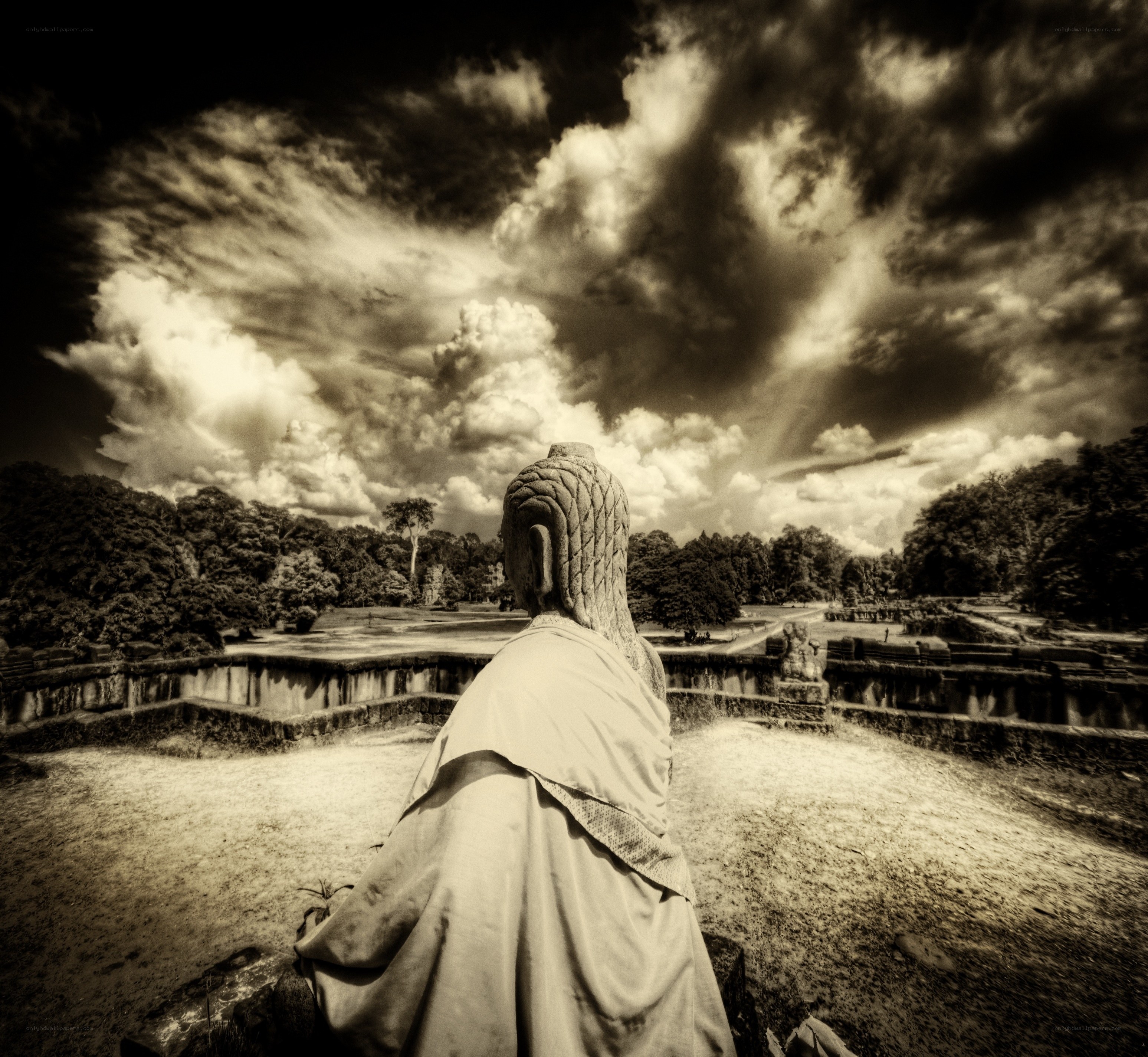 Buddha statue overlooking ancient ruins