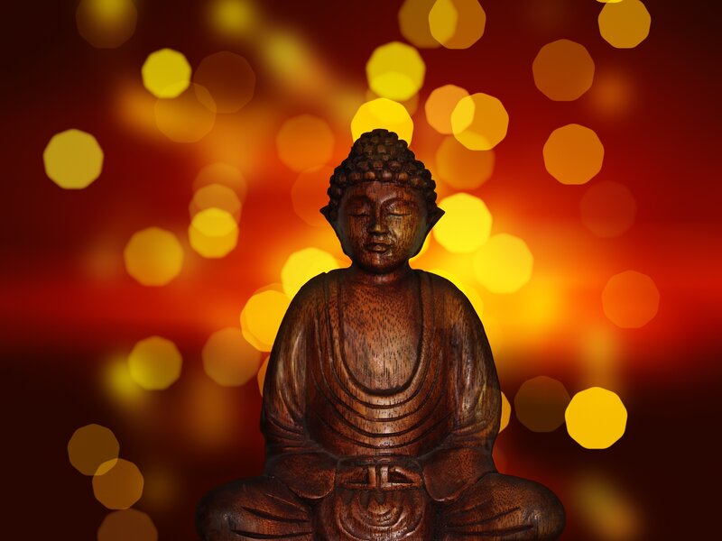 Buddha statue with bokeh lights
