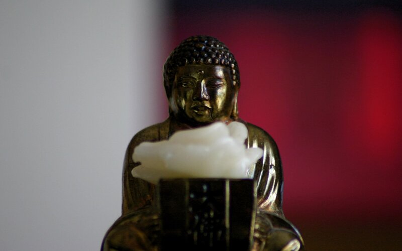 Buddha statue with incense