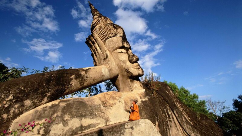 Buddha statue with monk