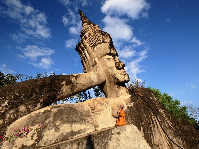 Buddha statue with monk