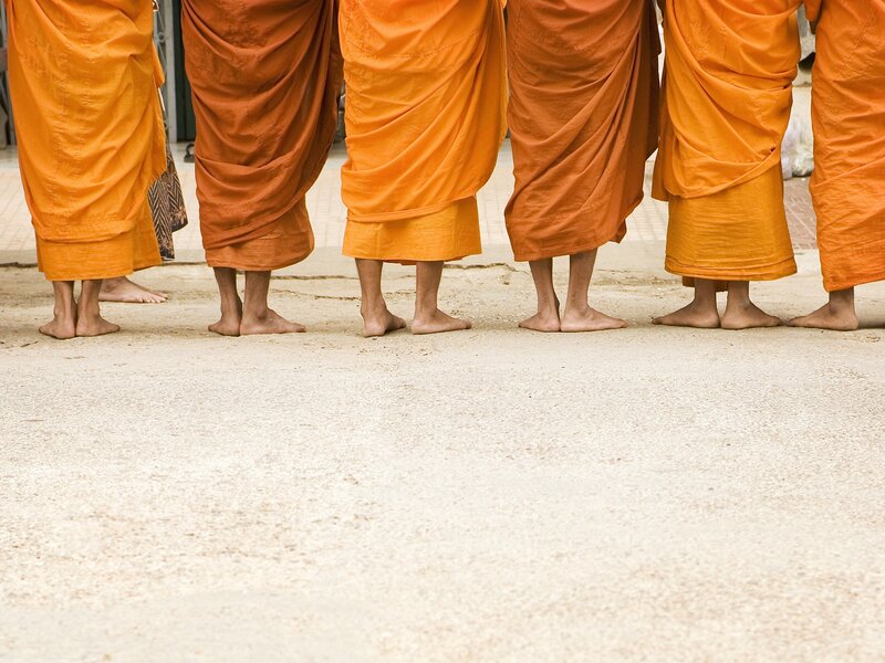 Buddhist monks in orange robes