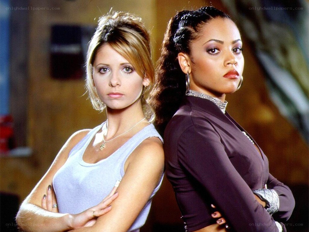 Buffy and Willow standing back to back