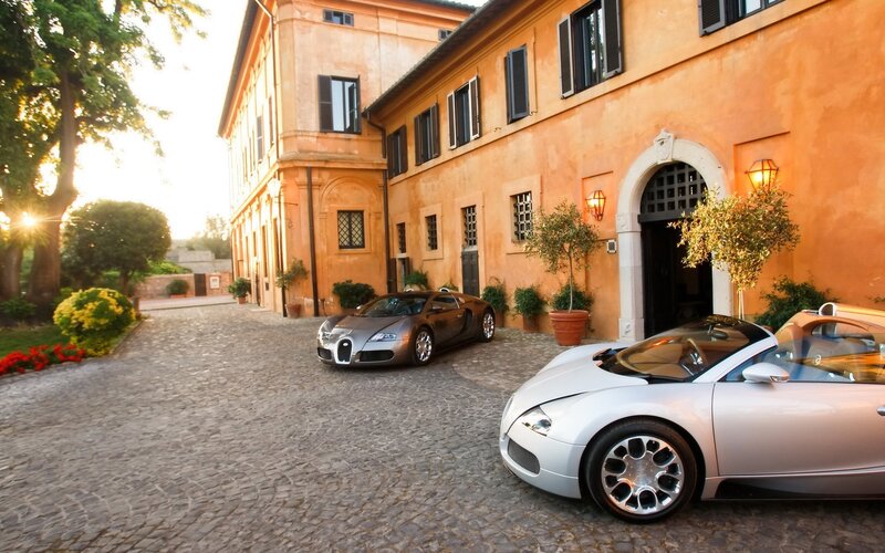 Bugatti cars at a villa